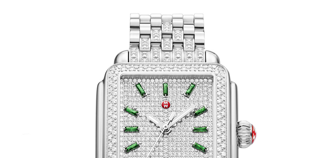 Limited-edition Deco watch featuring diamond-covered dial and emerald indexes.