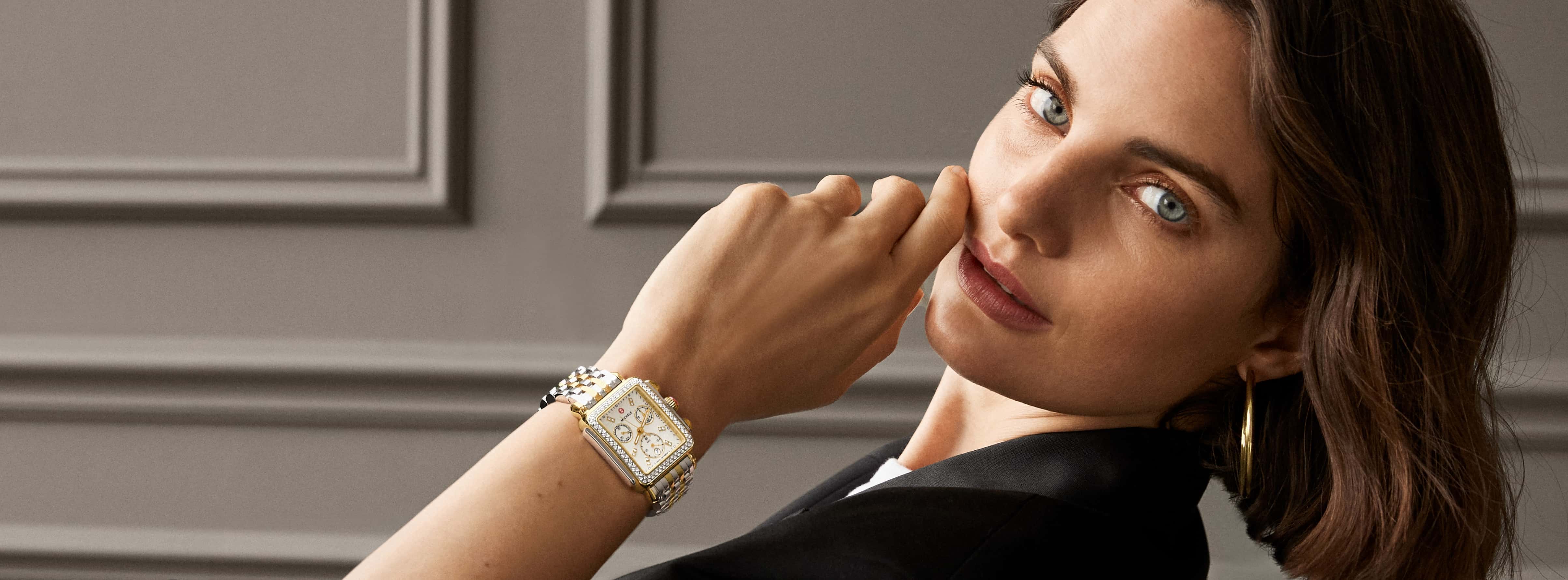 Female model wearing a Michele watch. 