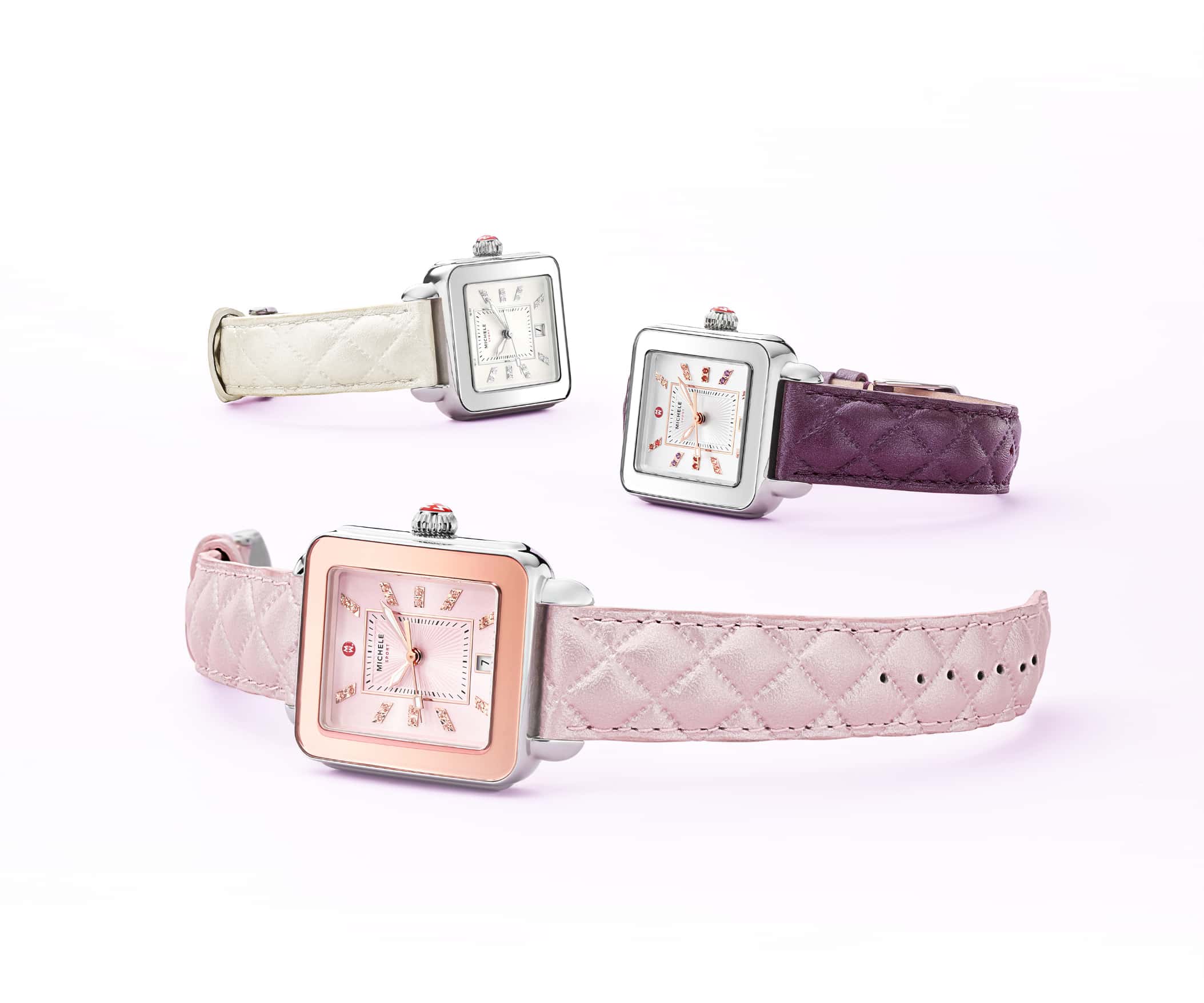 Three Deco Sport watches featuring sheen-finished quilted leather straps in lilac, violet and whtie and colorful topaz indexes.