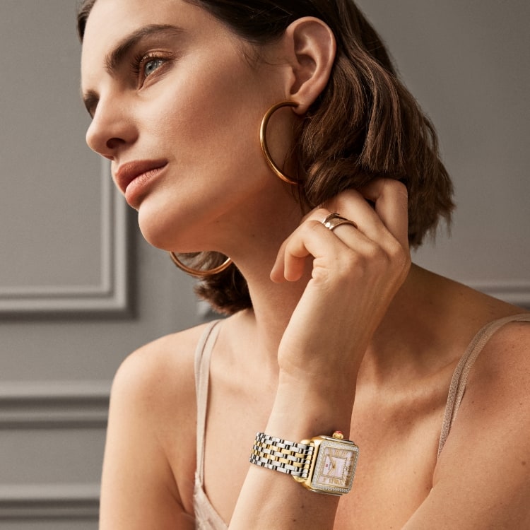 Woman wearing the Deco Madison Diamond Peony watch in two-tone