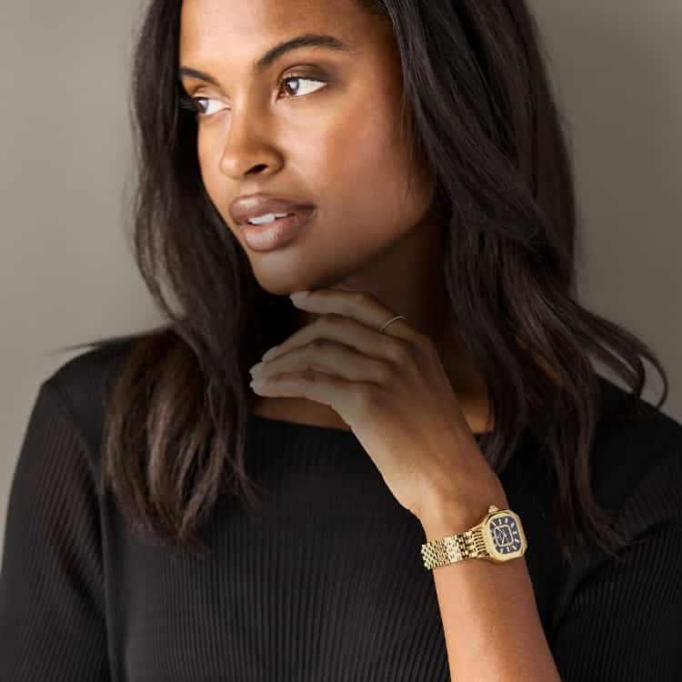 Woman wearing the Meggie Diamond Dial 18K Gold-plated watch in Noir Gloss