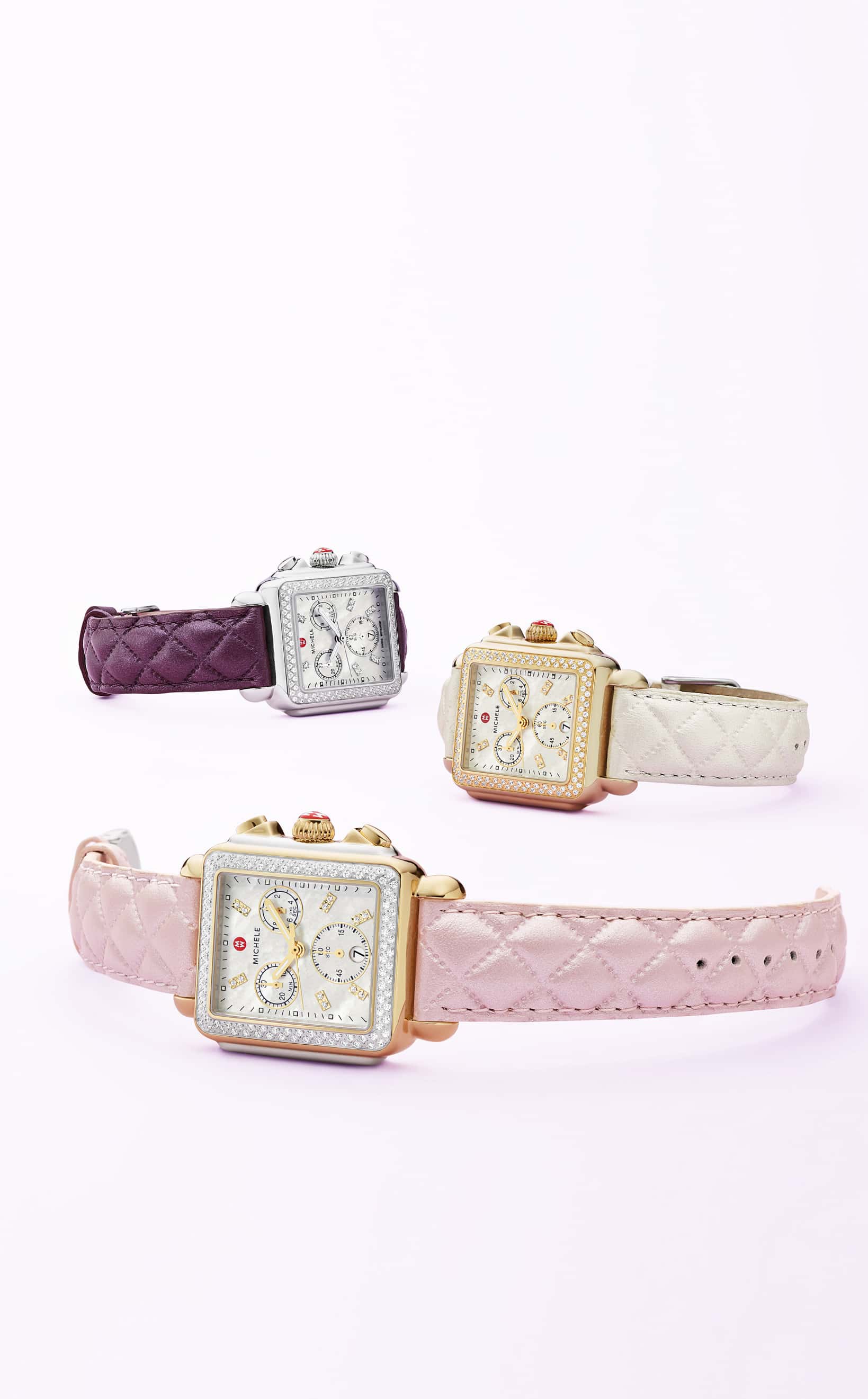 Three Deco watches with purple, pink and white quilted-leather straps.