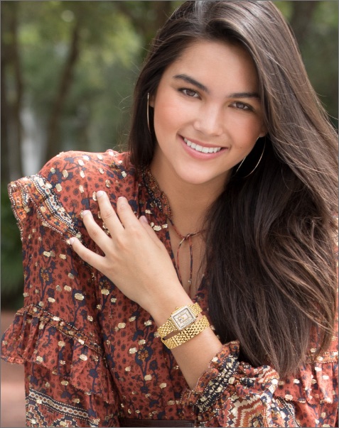 Sophisticated woman wearing stainless Deco watch with a sky blue dial.