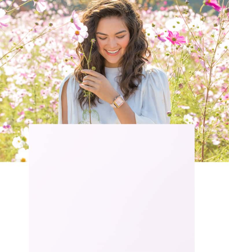 Fashionable, chic woman wearing Glo Show Deco Sport watch featuring an iridescent leather strap, mirror topring and pink topaz indexes.