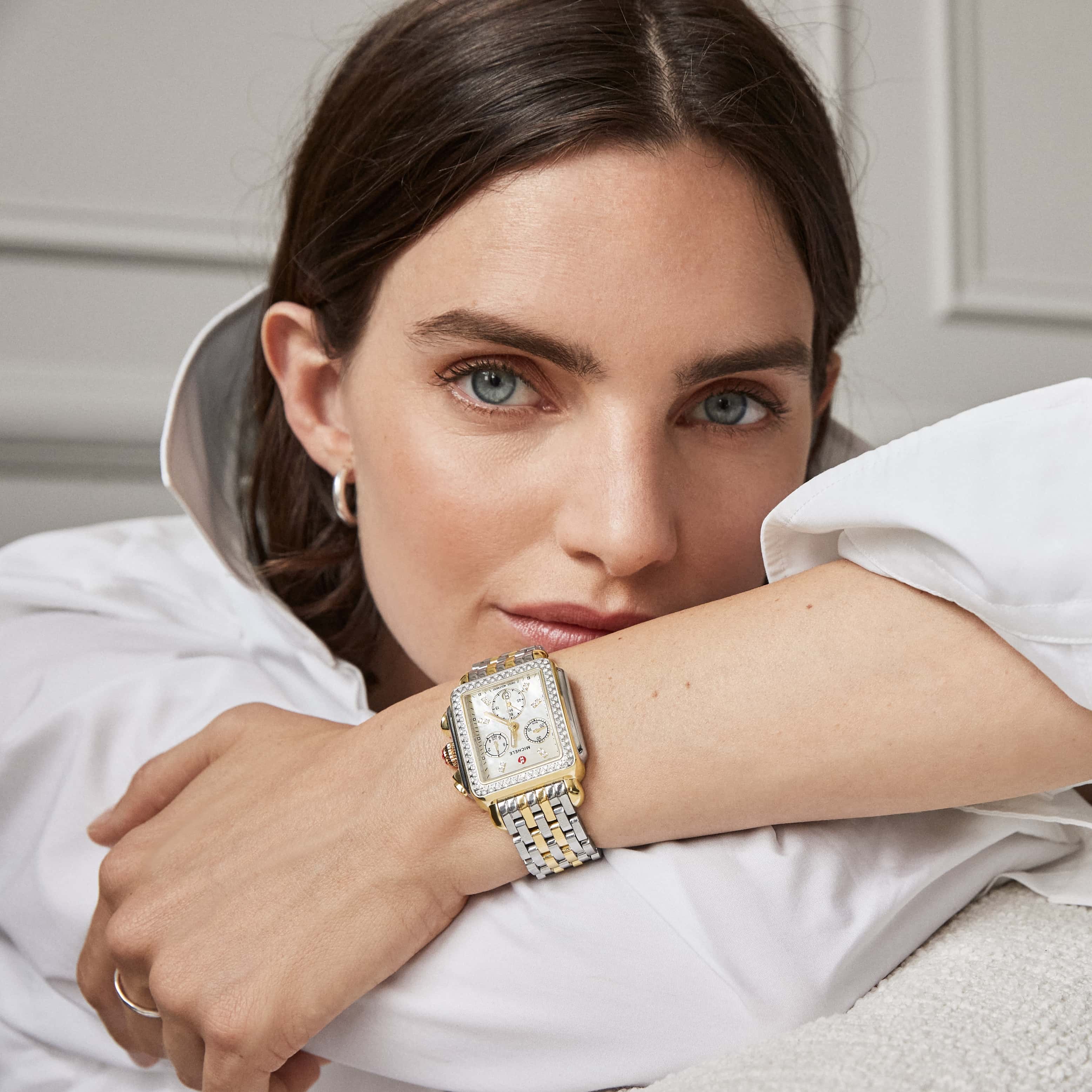 Woman wearing a MICHELE Deco Two-tone Diamond watch
