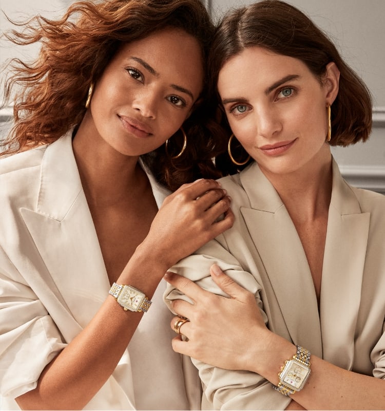 Two women wearing Deco watches