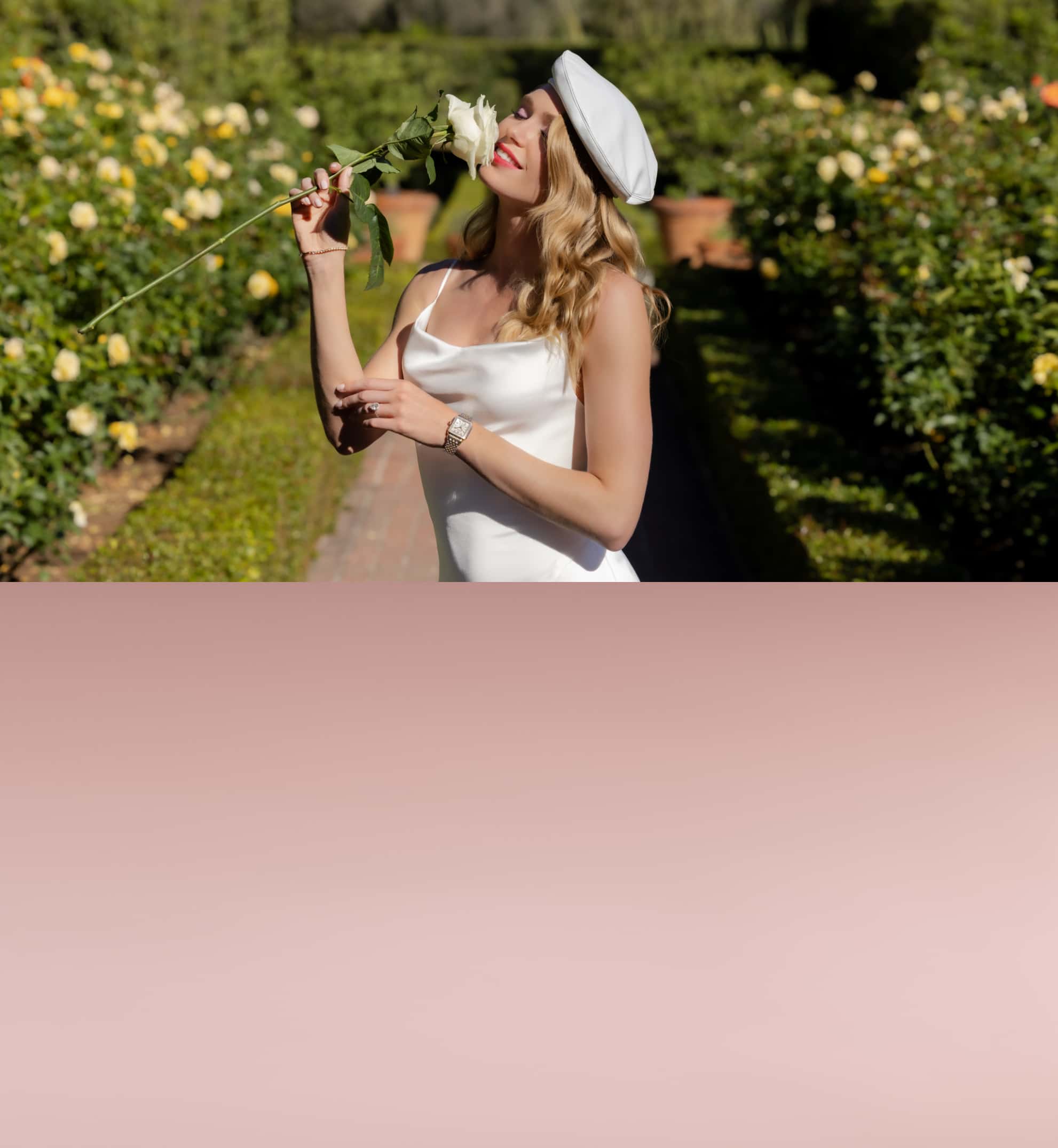 Woman wearing a white gown in a garden wearing a MICHELE watch