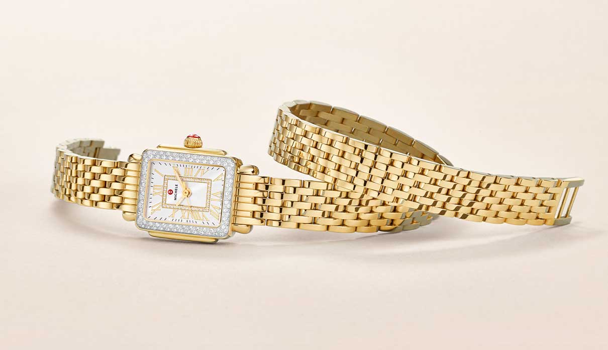 A double-wrap gold watch.