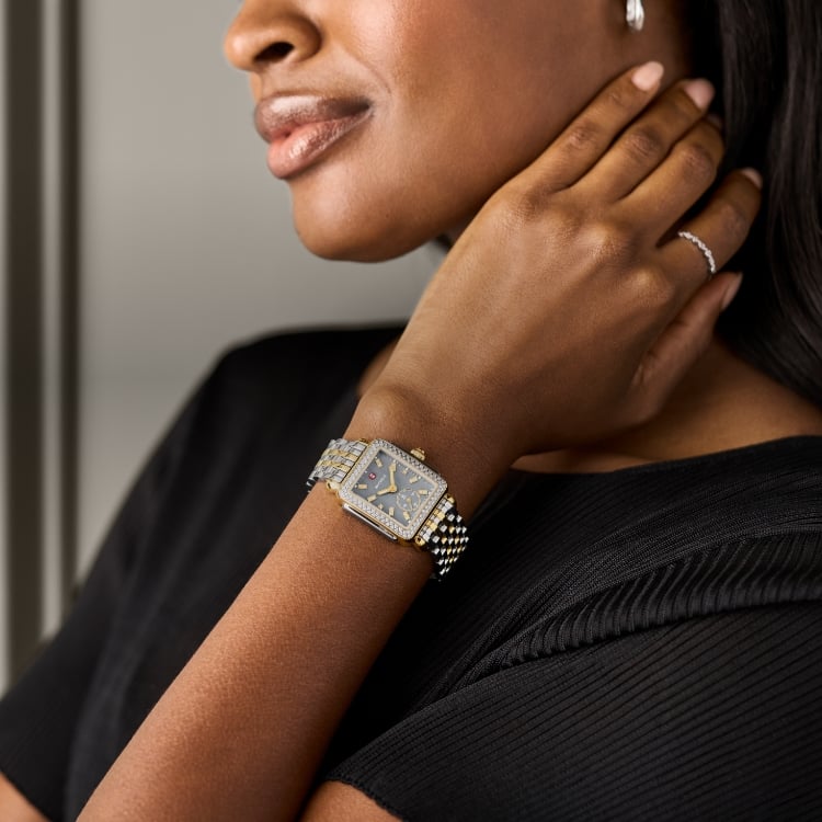 A woman wearing the Deco Mid Graphite Two-tone 18K Gold-plated watch