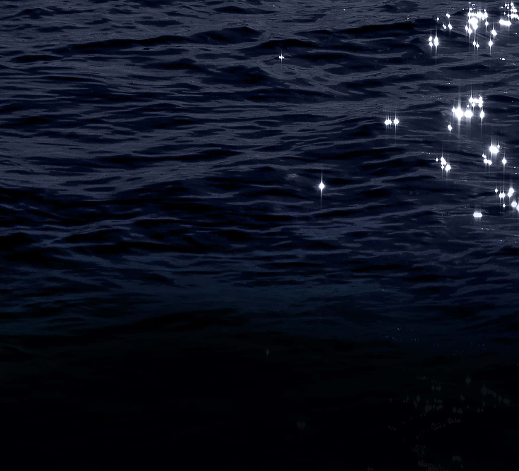sparkling dark waters of the ocean