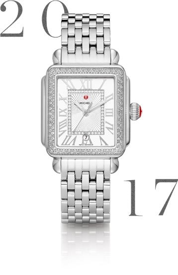 Deco Madison watch featuring silver-tone Roman numeral indexes, diamond innerring, date window, MICHELE logotype atop the dial and signature seven-link bracelet in stainless.