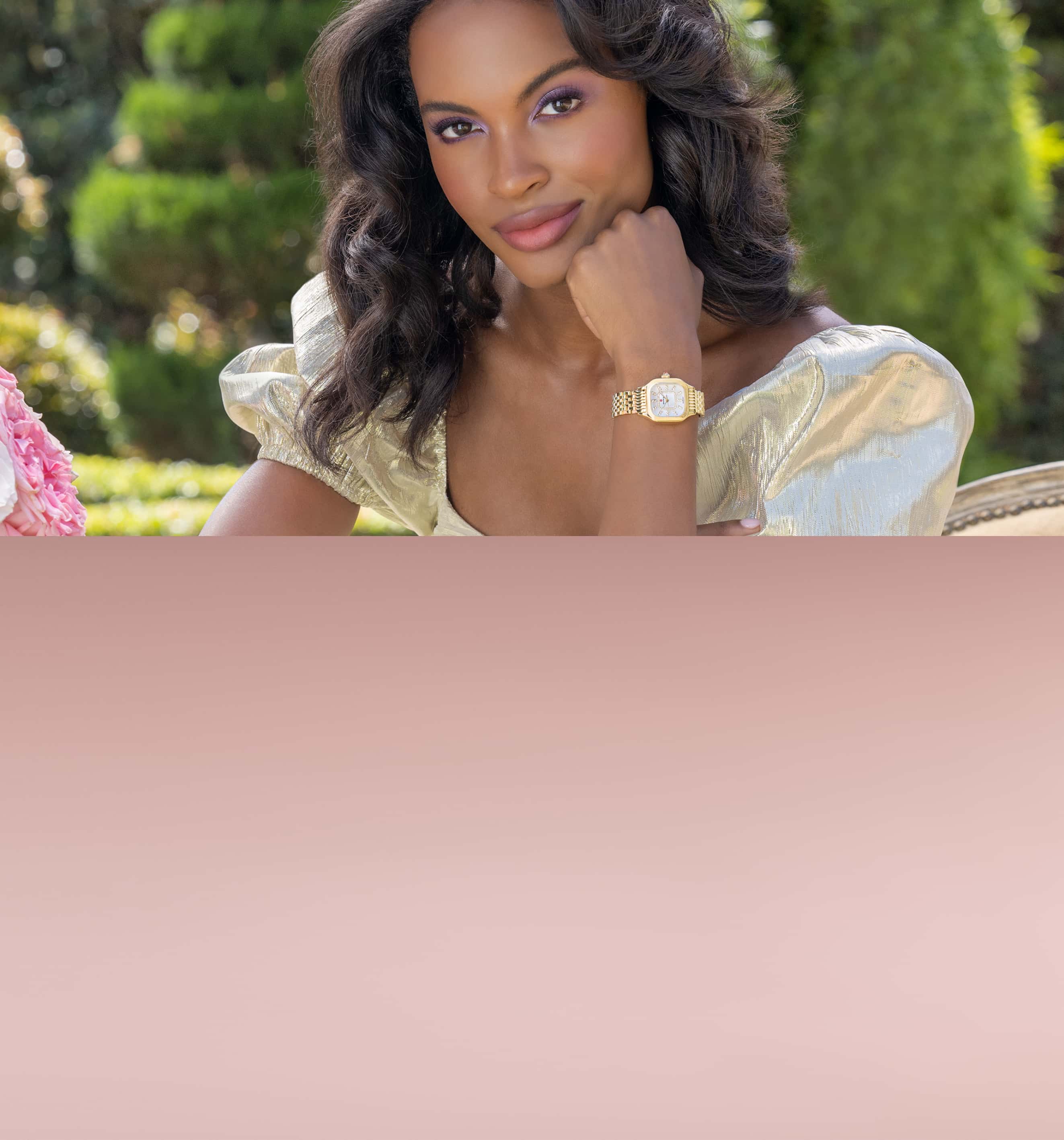 Woman in silver dress wearing a MICHELE watch