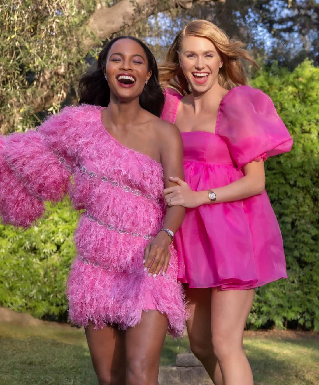 Image of 2 women in hot pink dresses wearing meggie watches by MICHELE