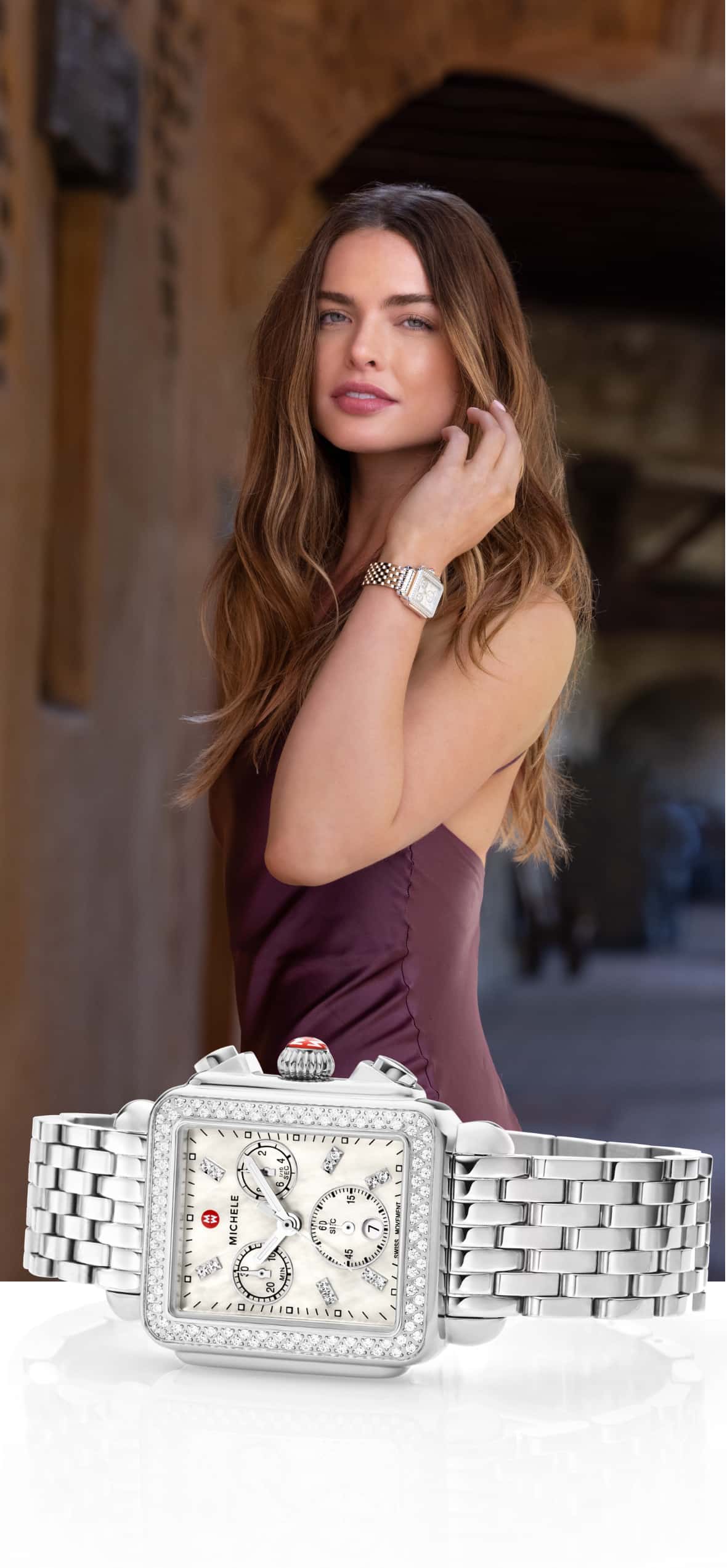 Chic woman in a maroon dress wearing stainess Deco Chronograph watch.
