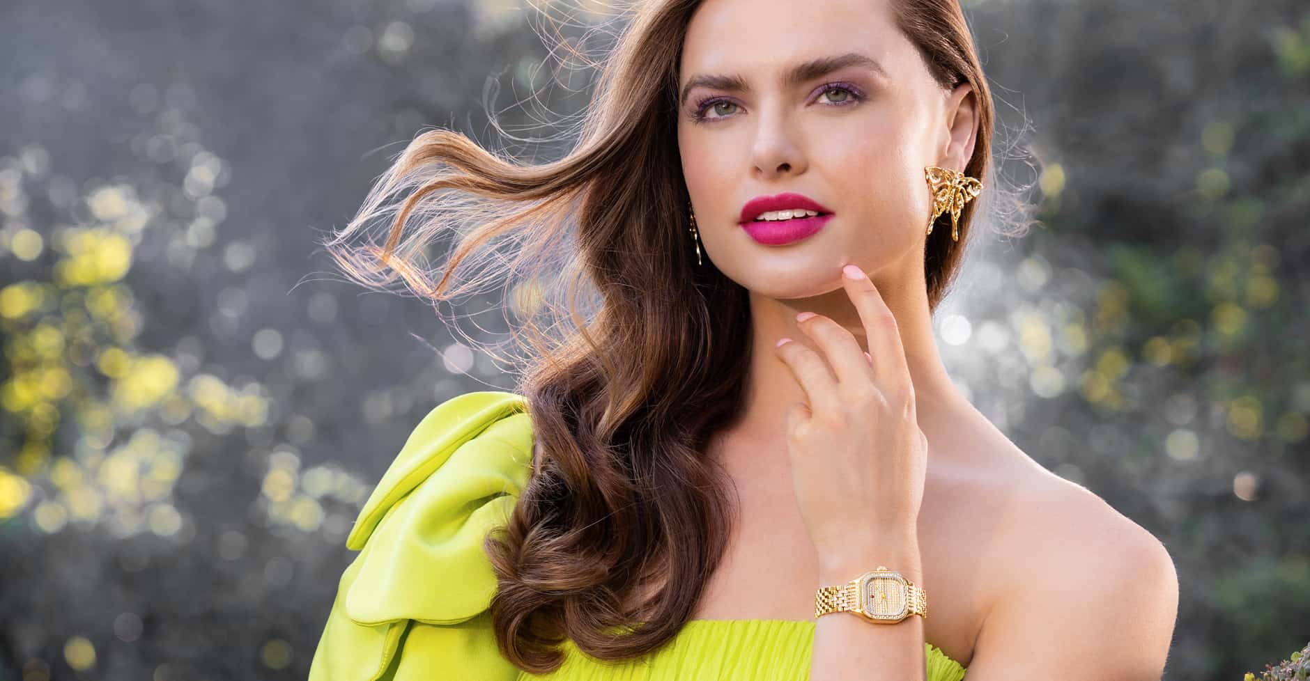 Woman wearing a yellow dress wearing a Limited Edition MICHELE Meggie watch