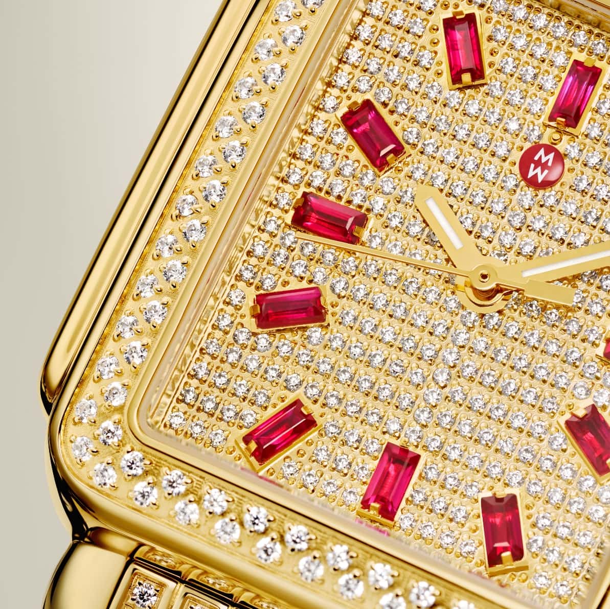 Detail shot of Deco Ruby Pavé watch in all-over gold and diamonds with 12 ruby baguettes