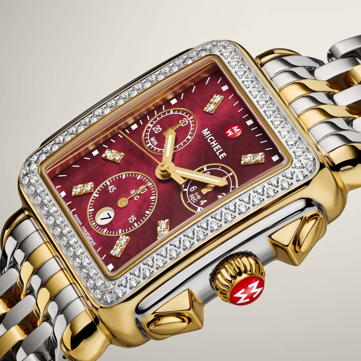 Detail shot of Deco Ruby Diamond watch in two-tone with a ruby red face and double diamond indexes