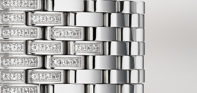 Close up of the signature seven-link stainless steel bracelet encrusted with pavé diamonds