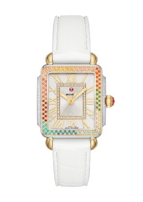 Deco Diamond Madison Mid Carousel watch featuring a rainbow of topaz stones atop the bezel, mother-of-pearl dial, 18k gold case and white leather strap.