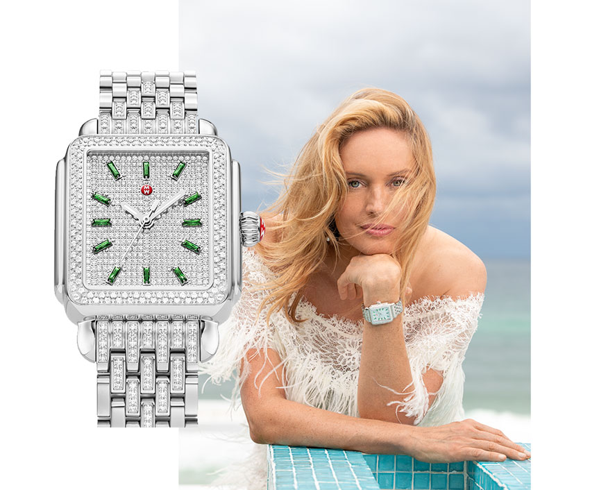Elegant woman wearing gown on beach wearing the Deco Stainless Emerald and Pavé Diamond Watch.