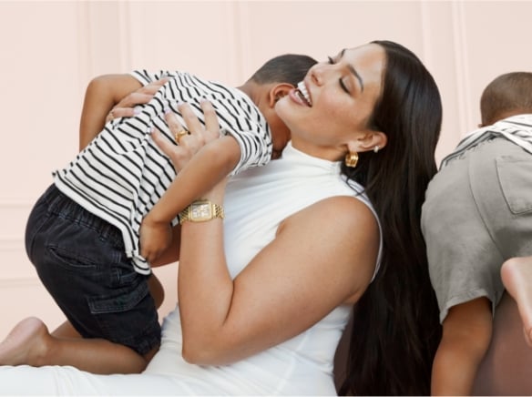 Ashley Graham and two of her sons. She's wearing the Deco Diamond Two-tone 18K Gold-plated watch.