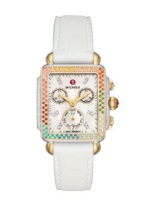 Deco Carousel Watch featuring a rainbow of topaz stones atop the bezel, 18k gold case and white leather strap.