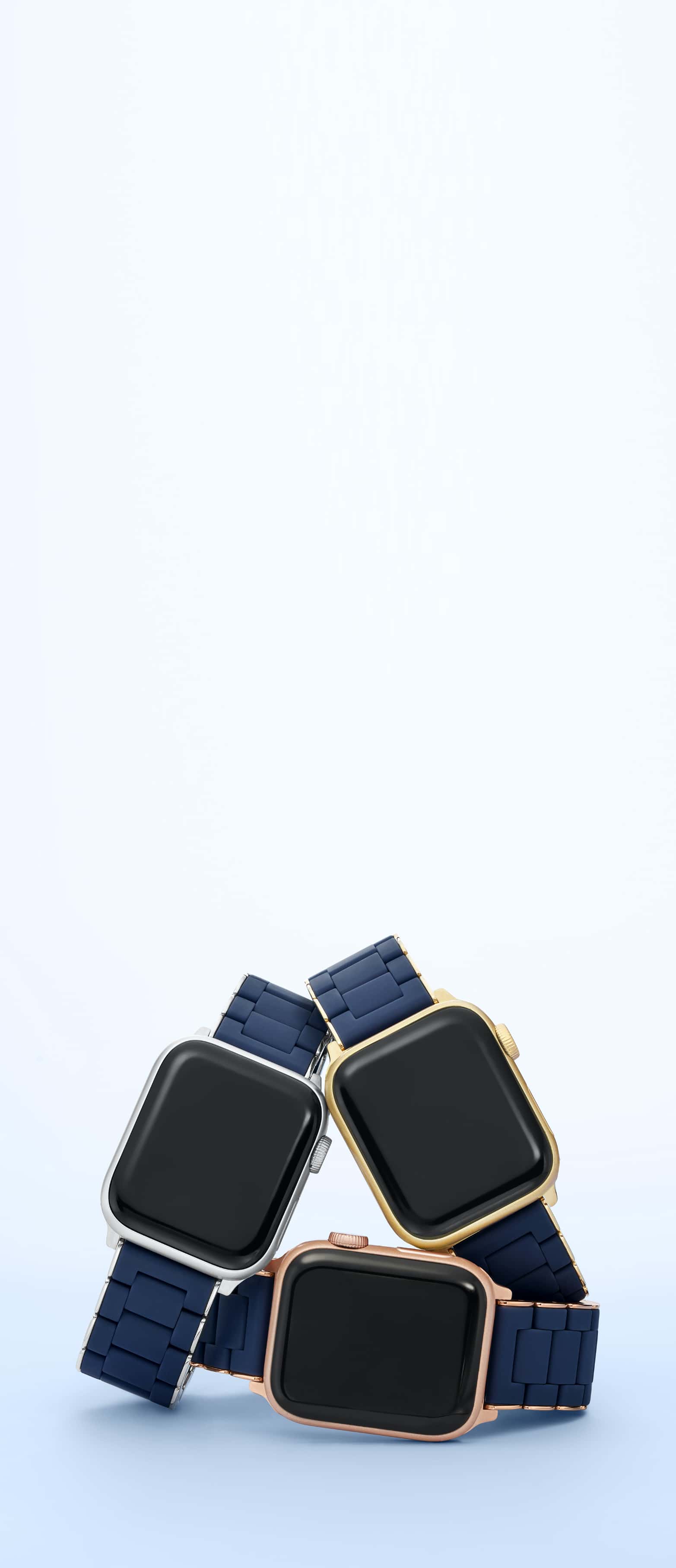 Three Apple Watches with midnight blue bands by MICHELE in sterling, gold and rose gold plating