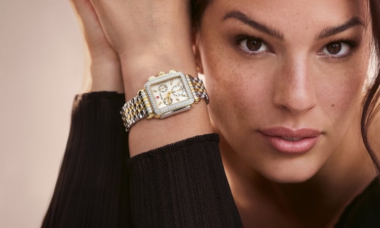 Close up of Ashley Graham wearing the Deco Diamond Two-tone 18K Gold-plated watch