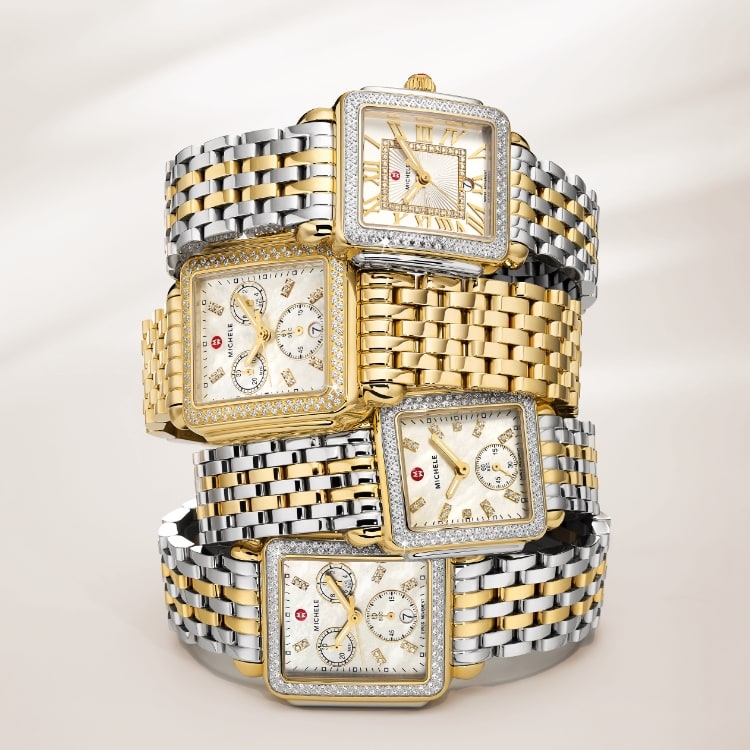 A stack of four diamond watches from the Deco Collection