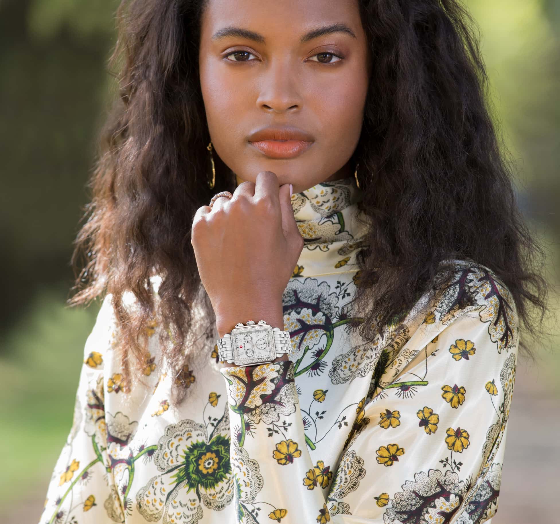 Chic woman wearing the Deco watch in stainless.